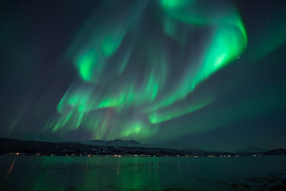 The Northern Lights dancing over Norway, , one of the top places for solo travel in 2023