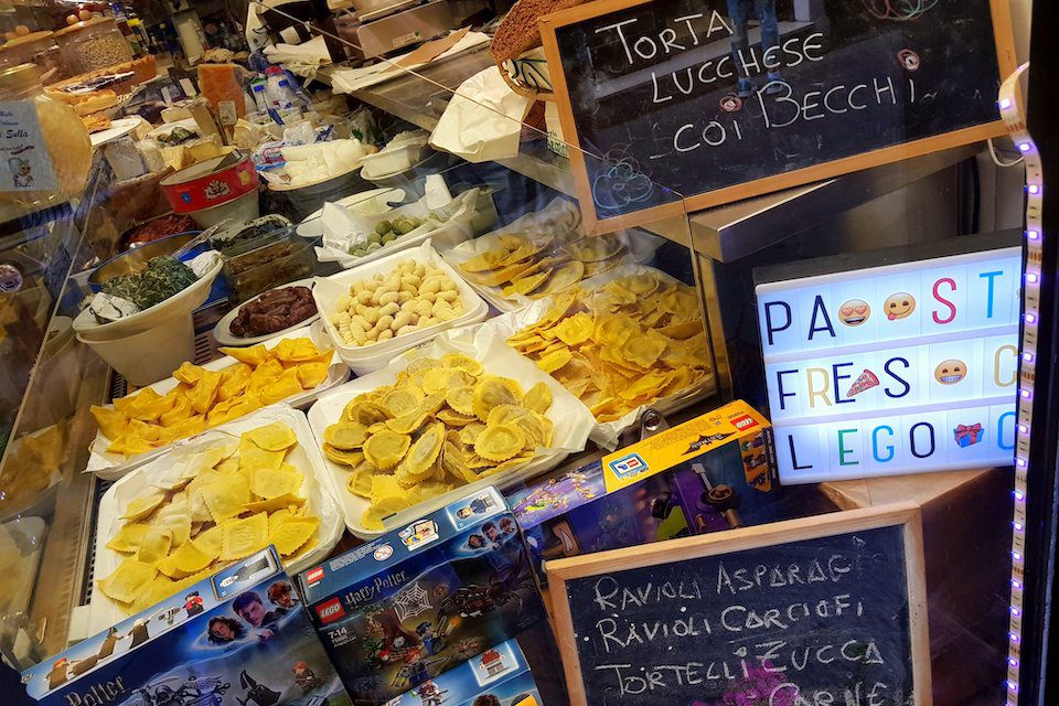 Plates of fresh pasta in a market window in Tuscany