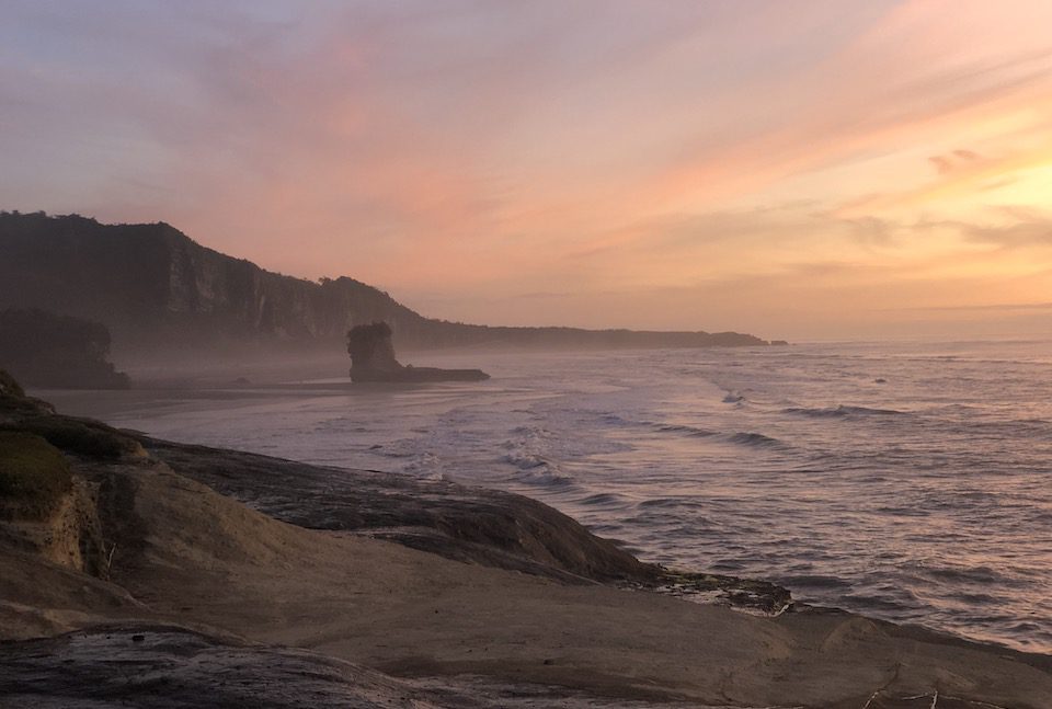 Sunset begins to paint the sky in Punakaiki