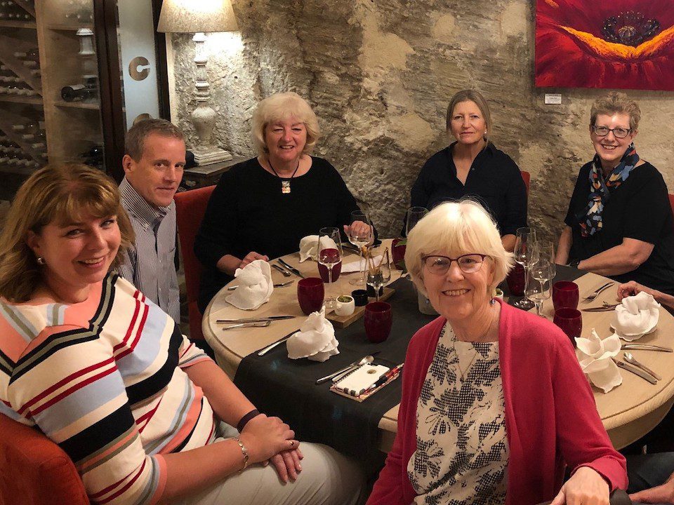 A group of travellers enjoying a meal with European Experiences