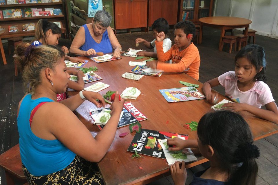 Jane getting crafty with local children in the library she volunteered at for six years in Peru