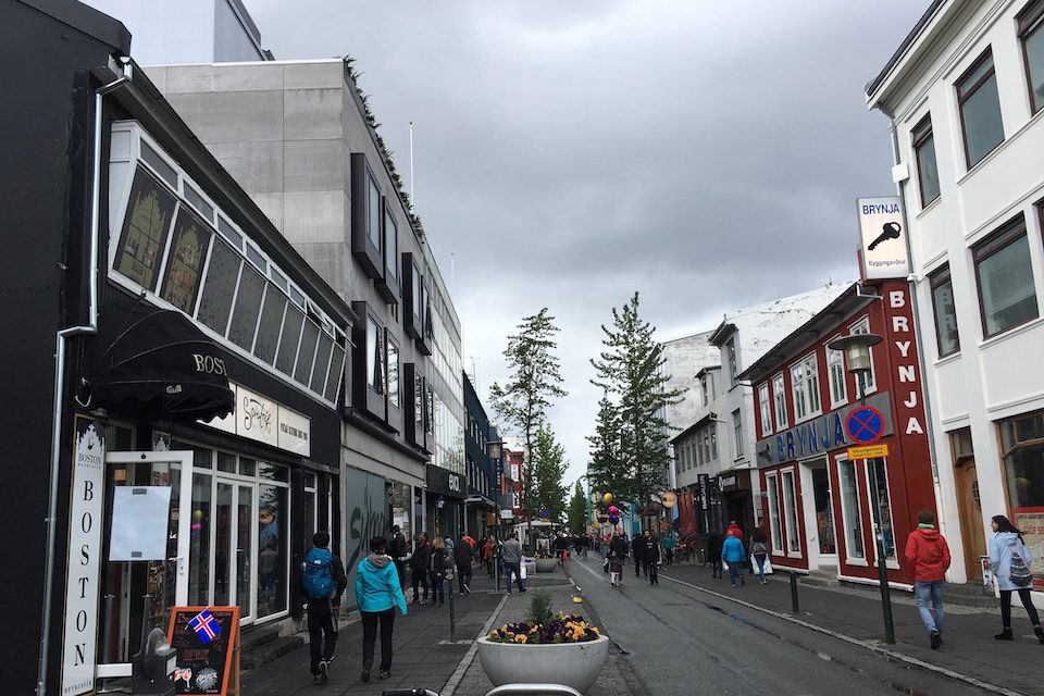 Shoppers making their way along a street in downtown Reykjavík
