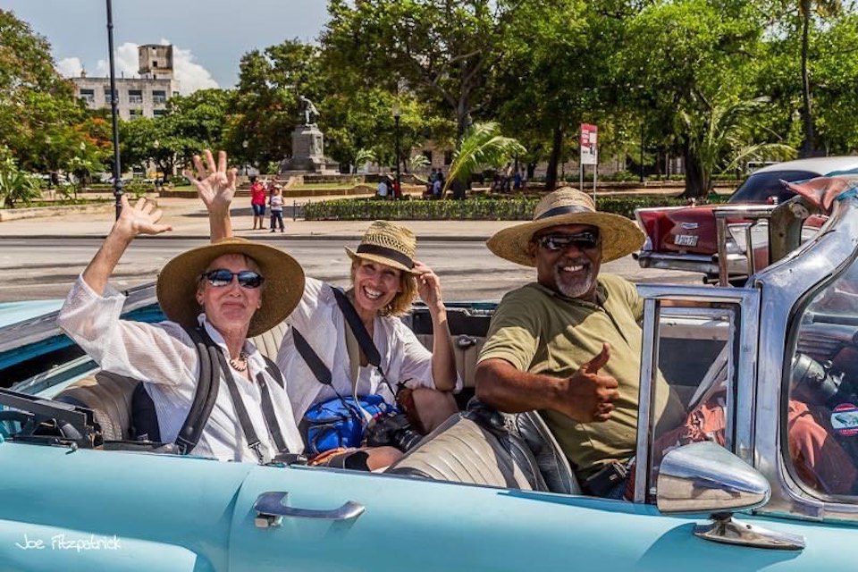 Peggy Farren (centre) on a car tour in Cuba