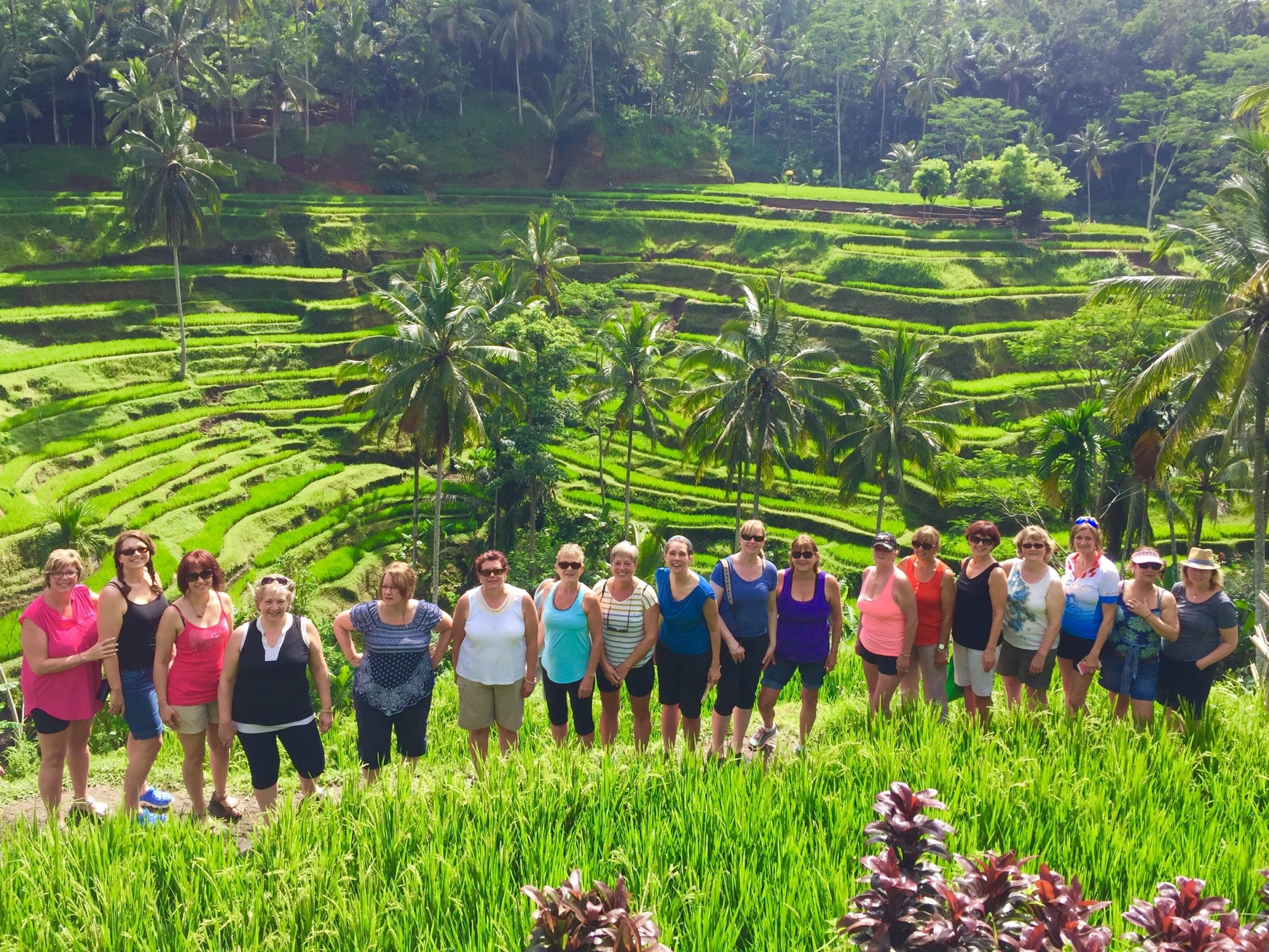 a group of women standing in a field