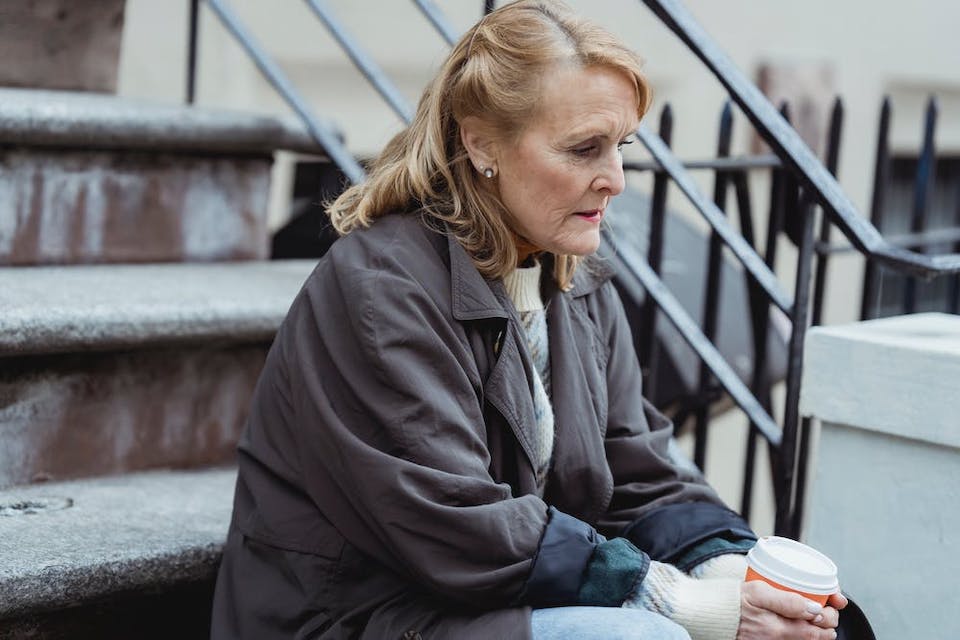 A woman sitting with her thoughts