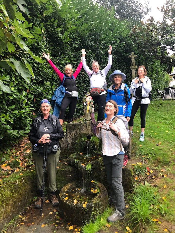 A group of women taking their first steps on the Camino de Santiago in Barbadelo, Spain