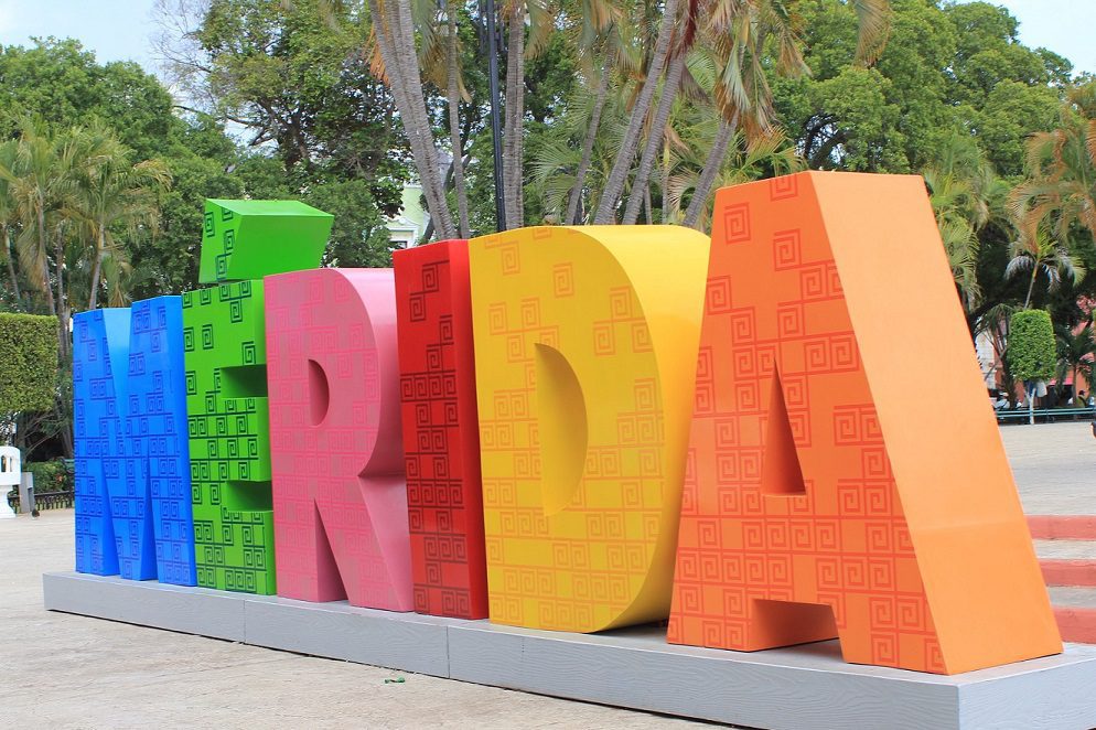 colorful welcome sign for solo travel in merida mexico