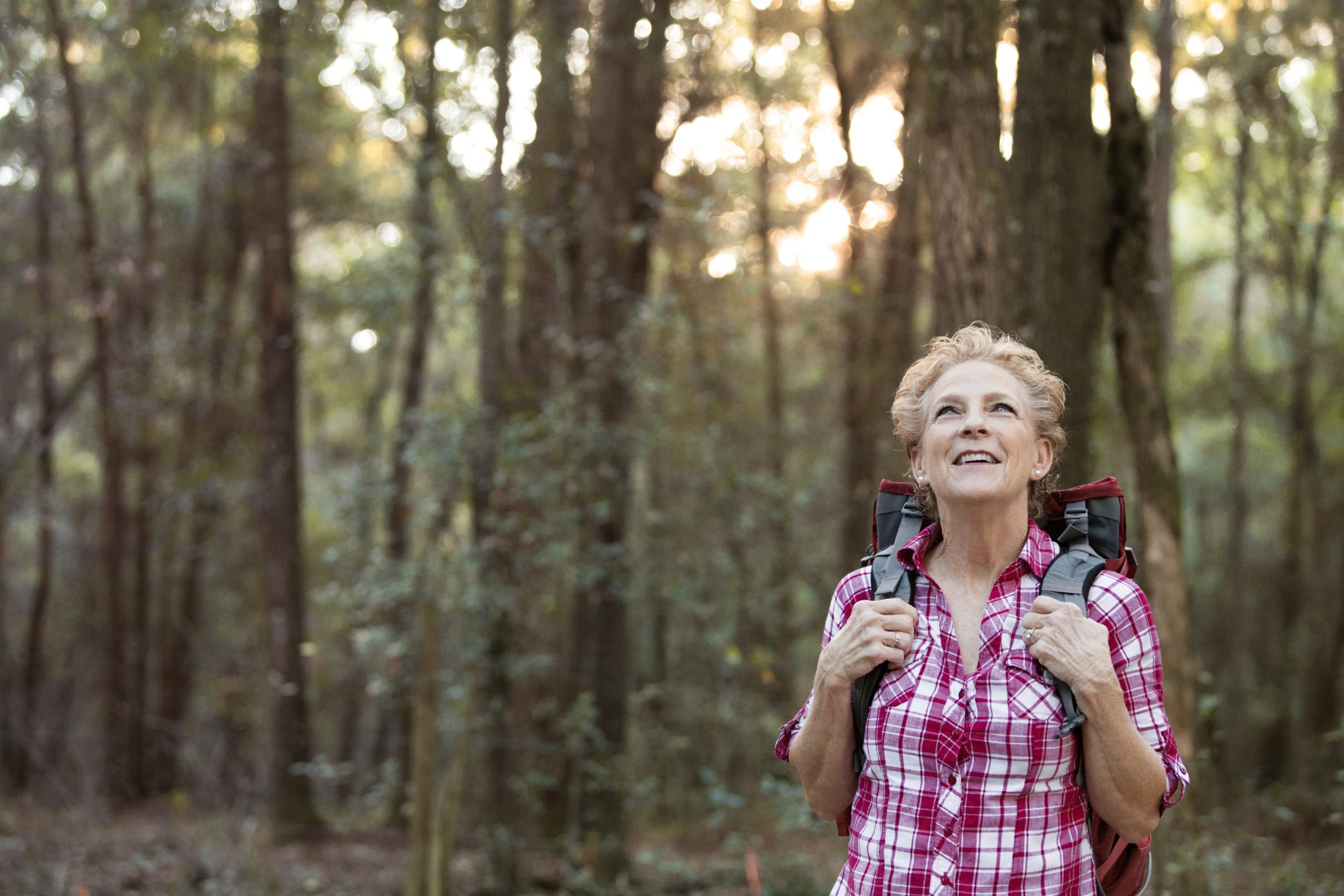 woman smiling in forest