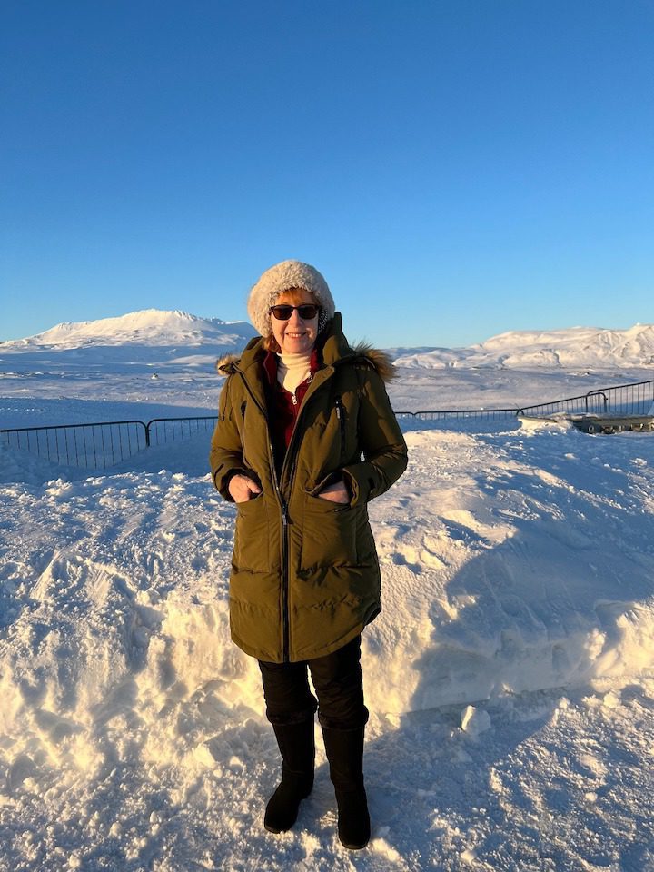 Diana Eden stands in the snow in Iceland