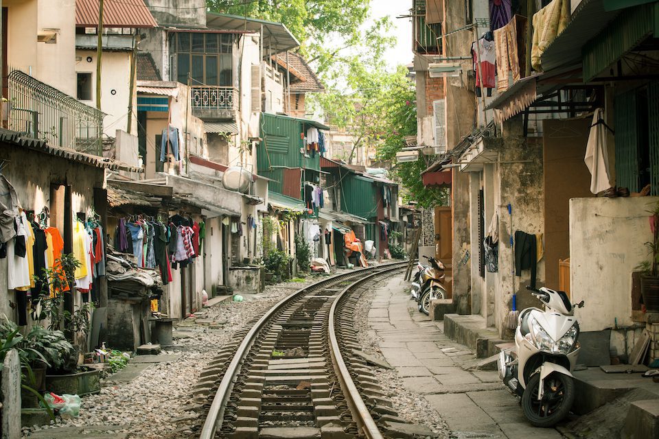 Train tracks through a street of houses in Hanoi, Vietnam