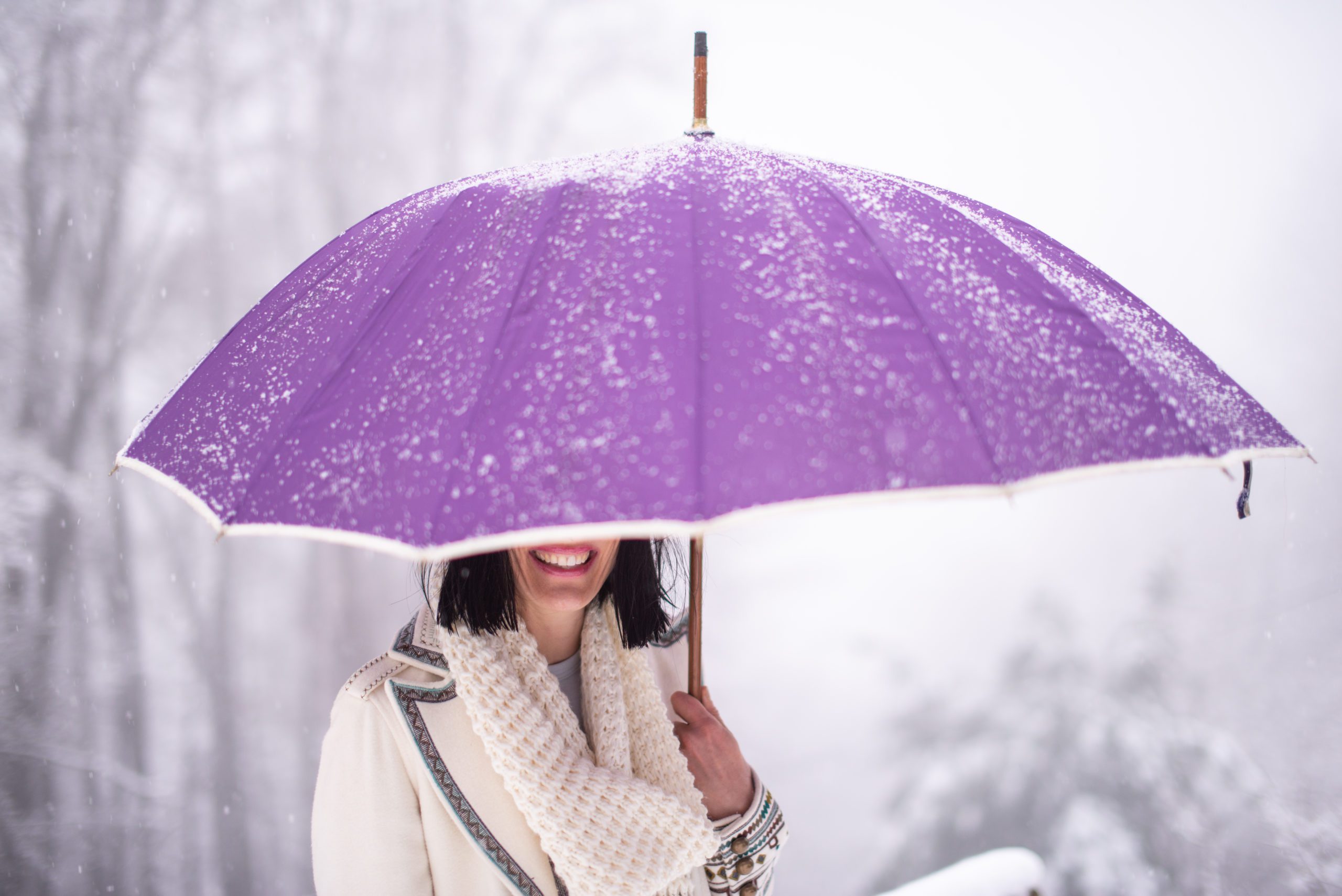 girl in rain purple umbrella