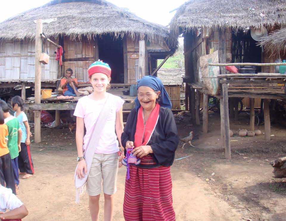 A girl and an elderly woman in a village in Thailand