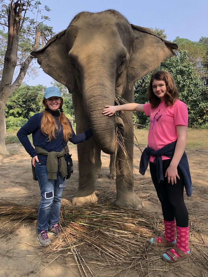 Ellen Urbani and her daughter pose with an elephant