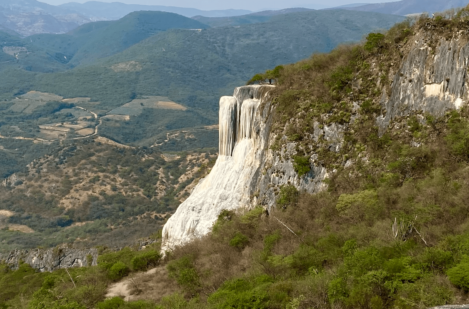 white waterfalls over a cliff