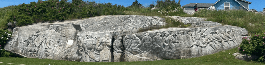 Rock carving of 32 fishermen in peggy's cove