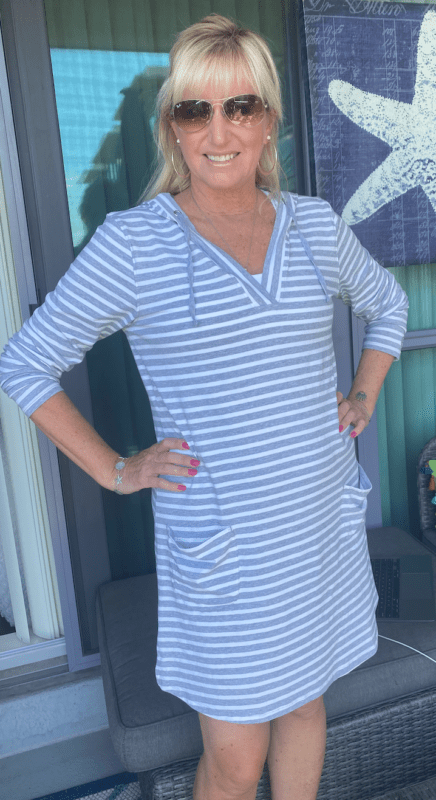 Carolyn wears a grey and white stripped long sleeve Coolibar dress