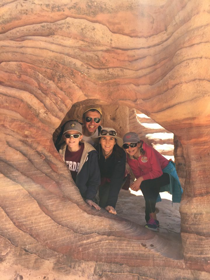 Shari and her family of four amongst a rock formation