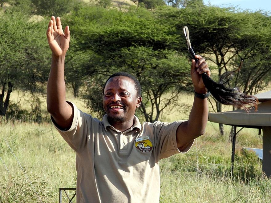 Bahati, a driver-guide on a safari in Tanzania