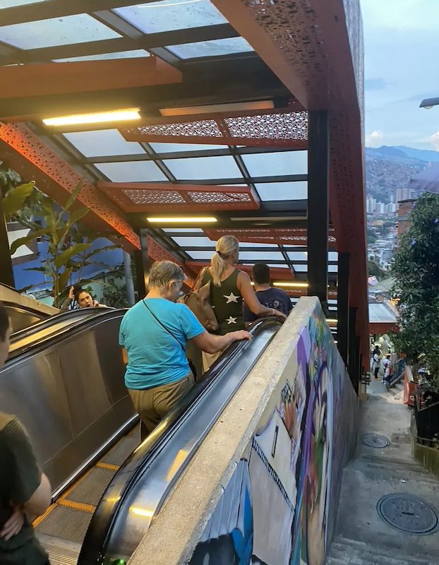 People standing on Medellin's escalators