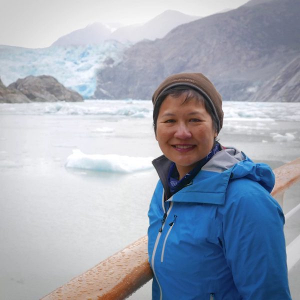 Norie Quintos in front of glacial water