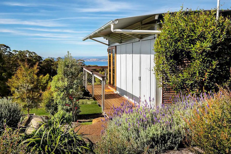 An Airbnb with a focus on accessible travel overlooking green hills