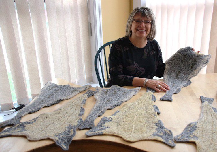 An artisan with her felt artwork