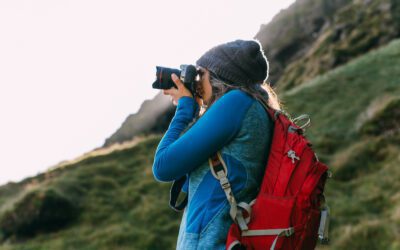 A woman photographs Iceland during her travels