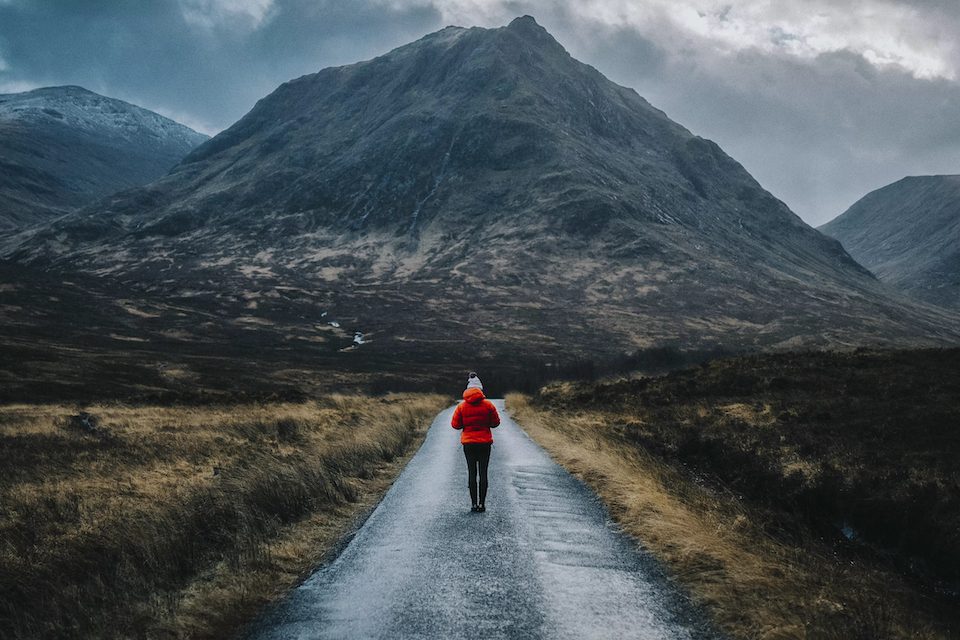 A Woman walking solo in Scottish highlands