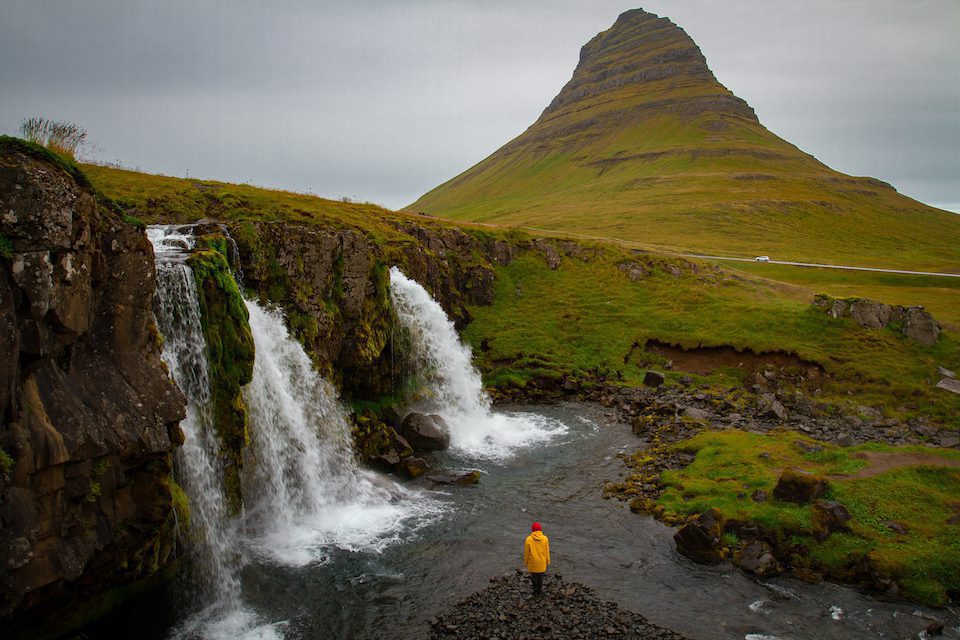 Women under a waterfall in Iceland