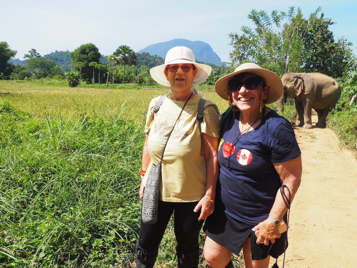 Sandy and Bonnie visiting elephants in Laos