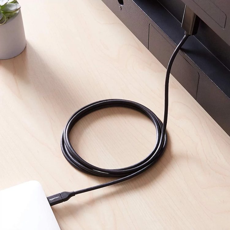 An HDMI cord connecting a laptop to a TV