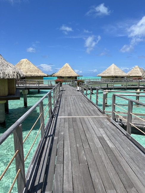 Walking along the over-water bungalows in Bora Bora