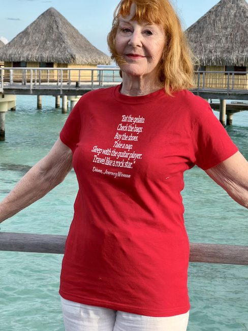 JourneyWoman Diana Eden wears her "Travel Like a Rockstar" shirt in Bora Bora