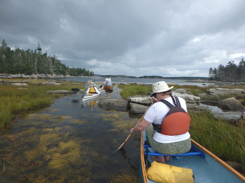 Taking a short cut between two islands before tide drops any lower