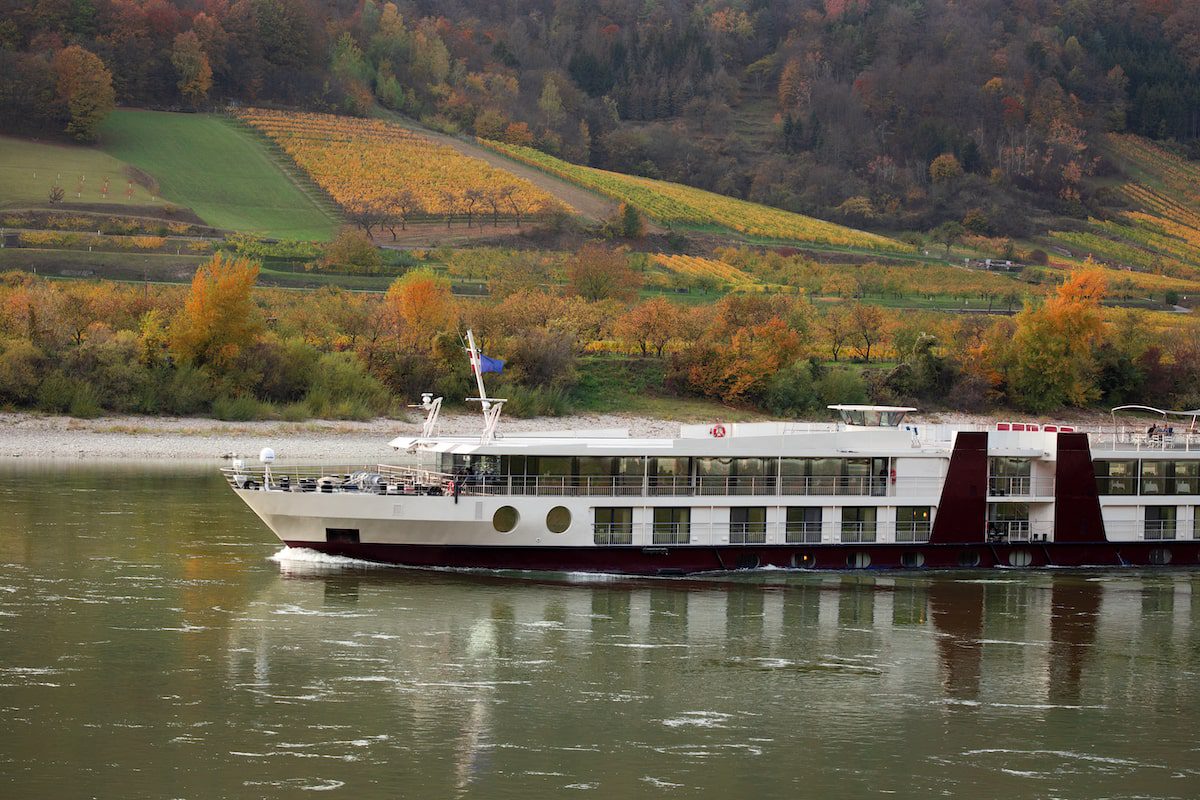 View of vineyards in sunset light, Wachau Valley, Austria as a river cruise sails by