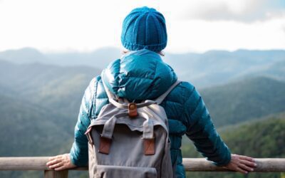 A woman hiker overlooks the mountains