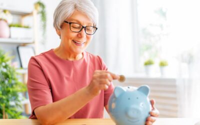 Woman adding coins to piggy bank to save money on travel