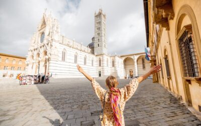 Woman enjoys beautiful architecture of Siena cathedral in Tuscany