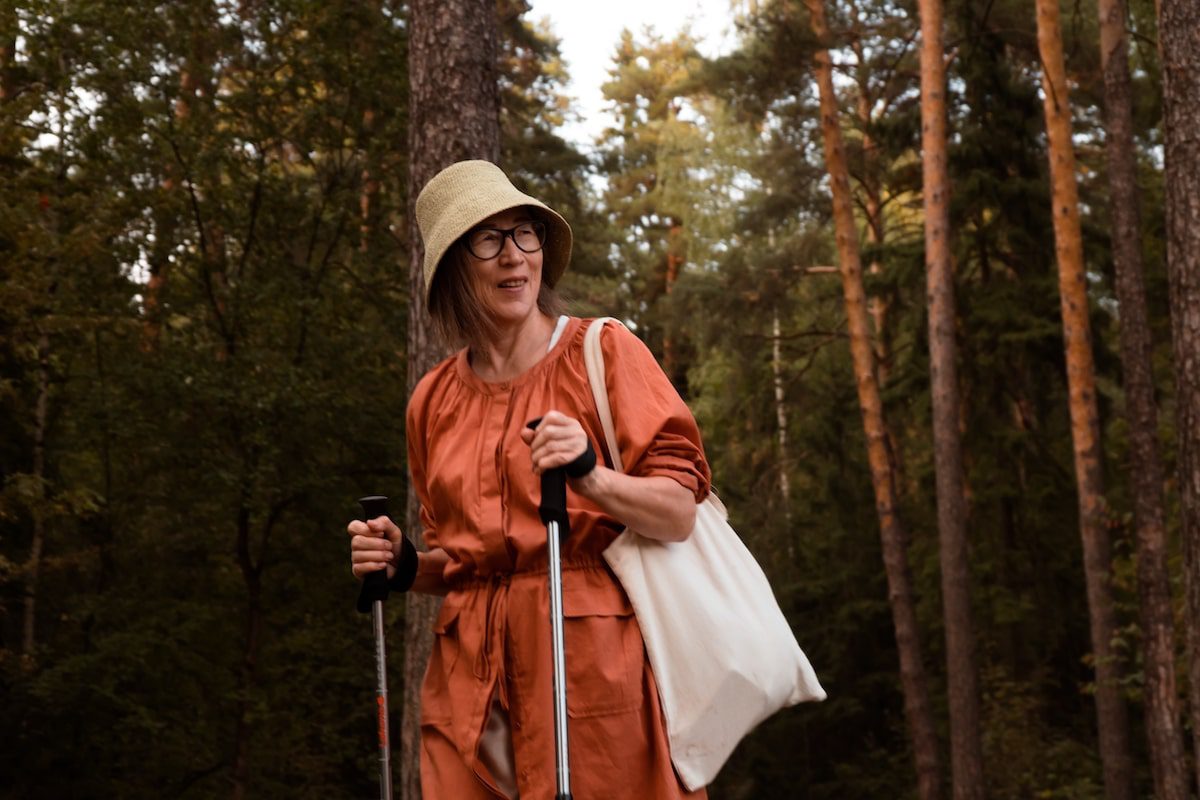 solo woman with hiking poles who's not thinking about loneliness