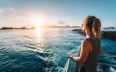 Woman on a boat overlooking the sea dealing with motion sickness