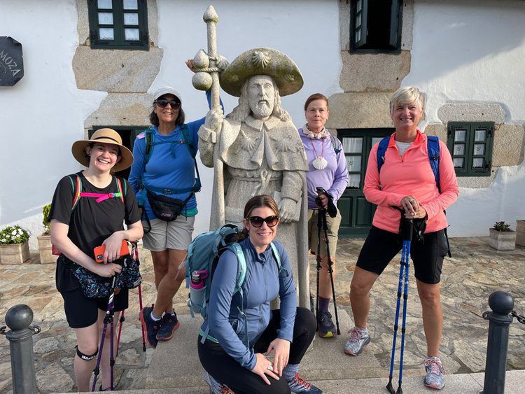 five woman standing on the camino trail