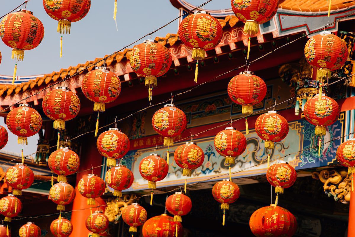 Chinese lanterns hanging in front of a Chinese temple
