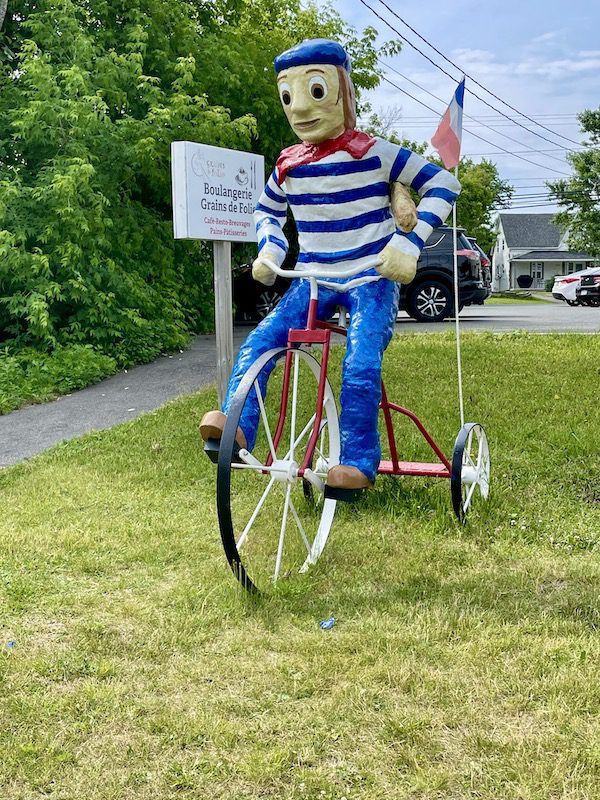A ‘cyclist’ in Caraquet welcomes other riders on the Acadian Peninsula Veloroute in northeast New Brunswick. (Photo by Pat Lee) 