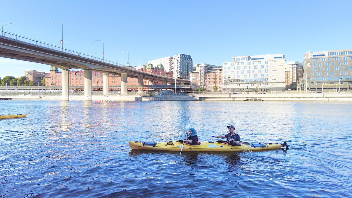 Tanzila Khan Kayaking through the Canal in Stockholm, Sweden