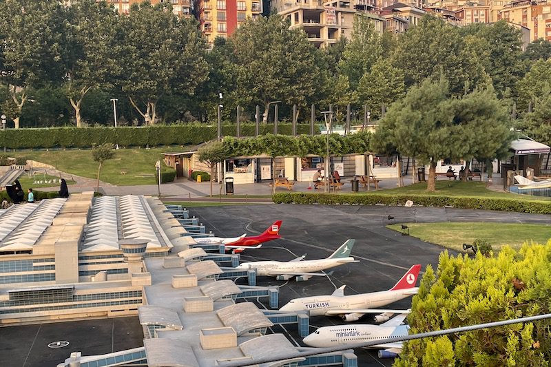 A row of miniature Turkish Airlines airplanes lined up in Miniaturk, Istanbul