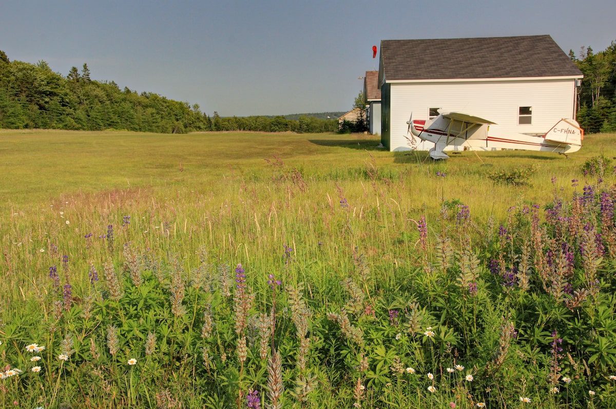 Small white plane in an old Airport in Deerfield