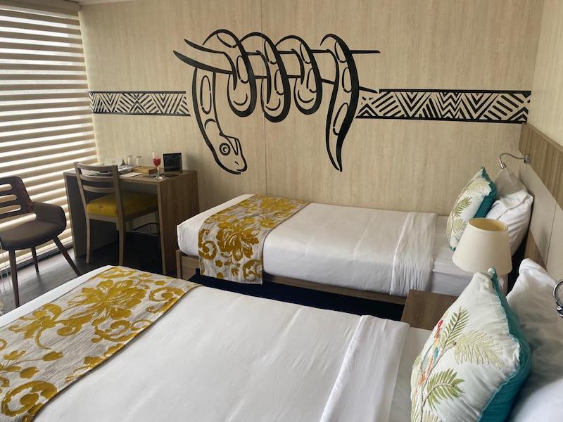 Two beds inside a room aboard the Amazon Explorer ship in Ecuador