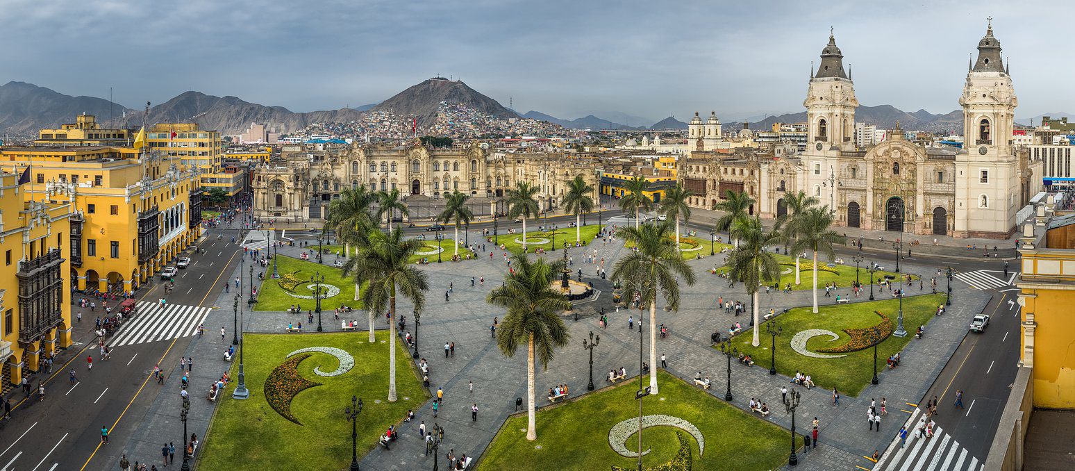 Peruvian square with buildings and trees surrounding