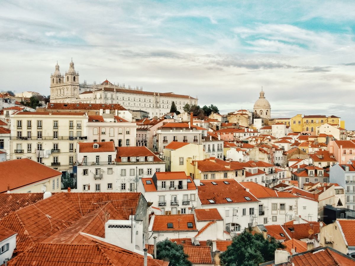 old white houses with terracotta roofs in lisbon portugal