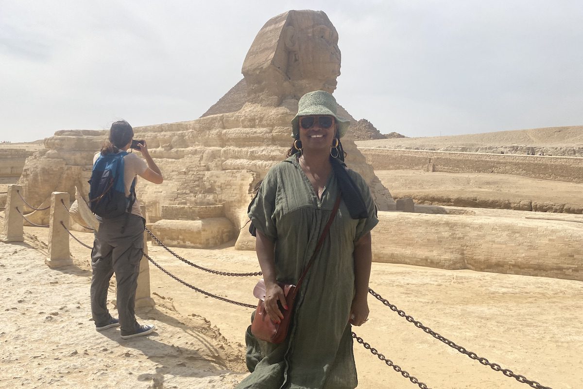 Dawn Booker poses in front of the Sphinx in Egypt